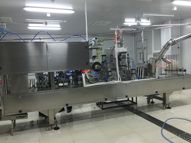 Cups filling sealing machine in factory tested ready for delivery